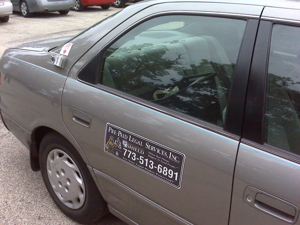 Is it illegal to put business cards on cars